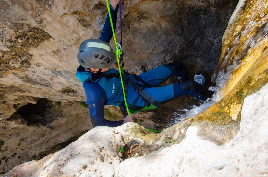 From Granada: Rio Verde Canyoning Tour with Lunch - Inside the Canyon: Slides, Jumps, Wells, and Rappels