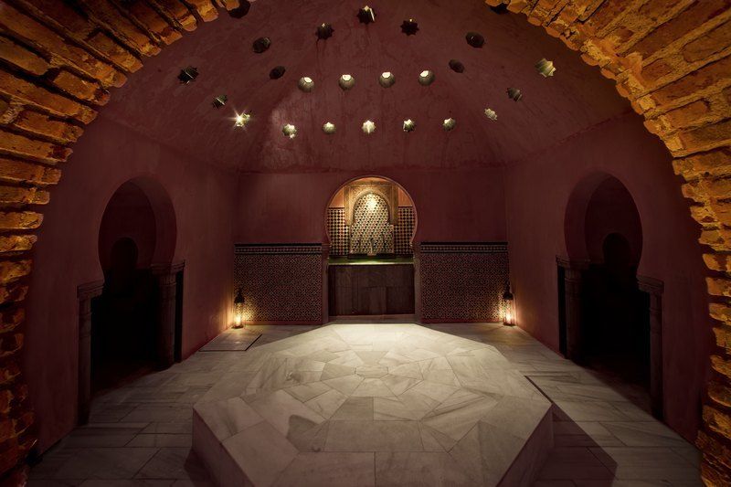 Granada: Alhambra Guided Tour and Arabian Bath and Massage - The Alhambra guided tour: Nasrid Palaces, Charles V, and the Alcazaba
