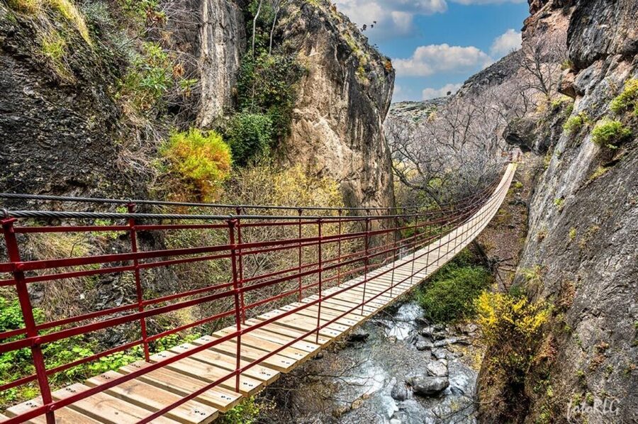 Granada: Guided Day Hike in Los Cahorros de Monachil - Returning via suspension bridge, then a riverbank pause