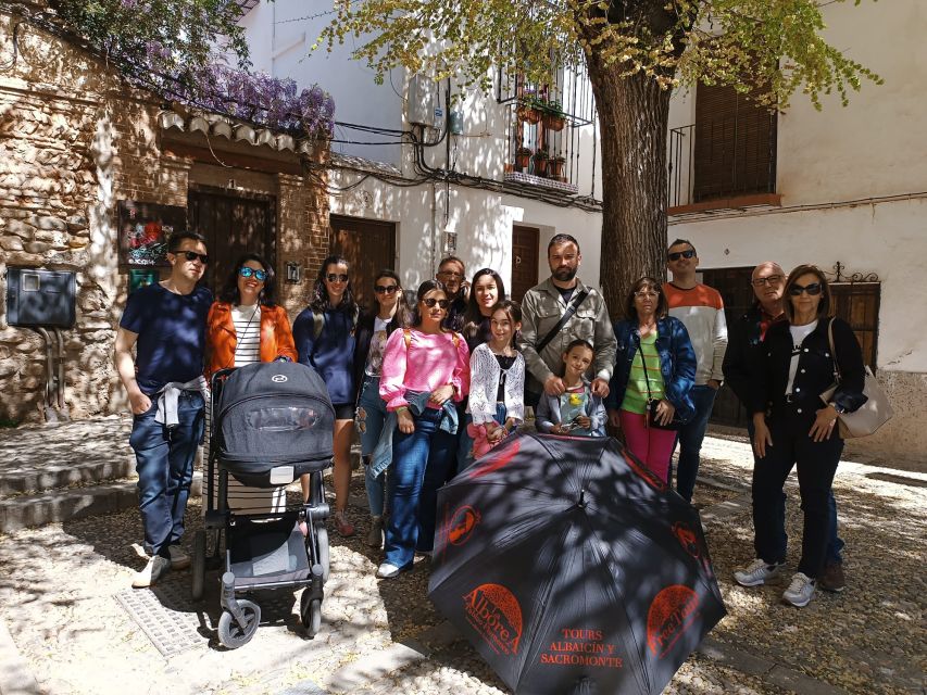 Granada: Historic Center and Lower Albaicin Walking Tour - Power, faith, and courts: Saint Ana, the Madraza, and royal buildings
