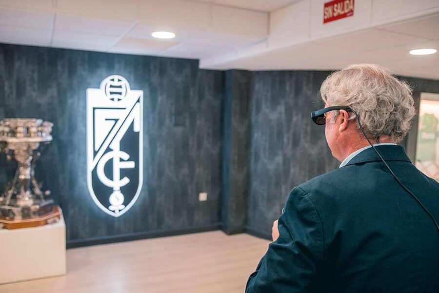 Granada: Los Cármenes Stadium Guided Interactive Tour - Players entrance, mixed zone mural, and the press conference room