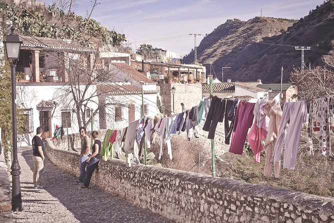 Granada's Hidden Treasures: Albayzin and Sacromonte Walking Tour - Paseo de los Tristes: Photos, Then Tapas Where the Name Fits