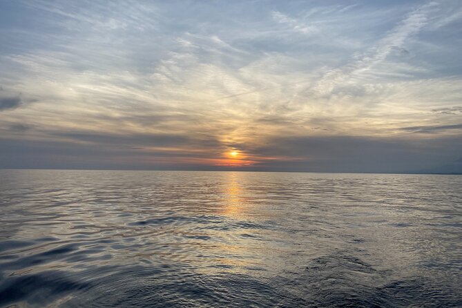 Sailing at sunset along the cliffs of Maro-Compartida - Key Highlights: Maro-Compartida Sunset Sailing in La Herradura