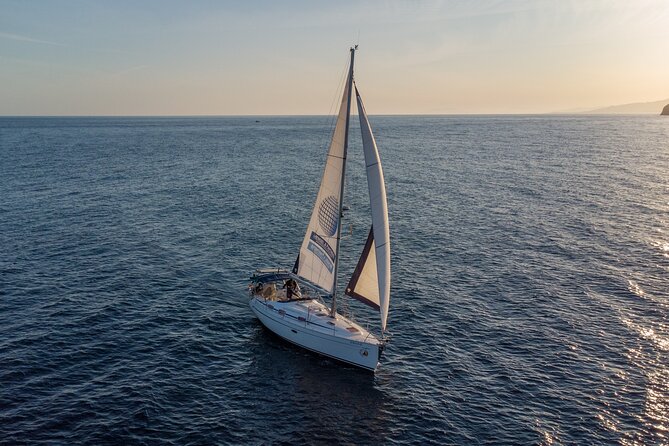 Sailing at sunset along the cliffs of Maro-Compartida - Why Maro-Compartida Sunset Sailing Feels Like Good Value