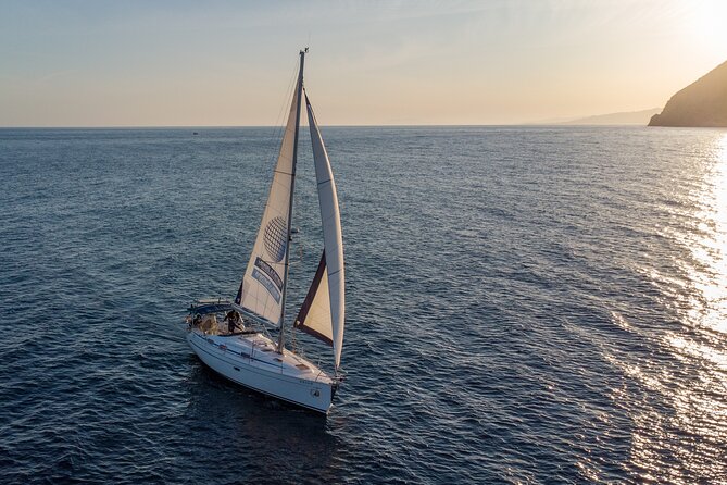 Sunset sailing along the cliffs of Maro- Private - The Booking Quirk: Passenger Selection for a 9-Person Ship
